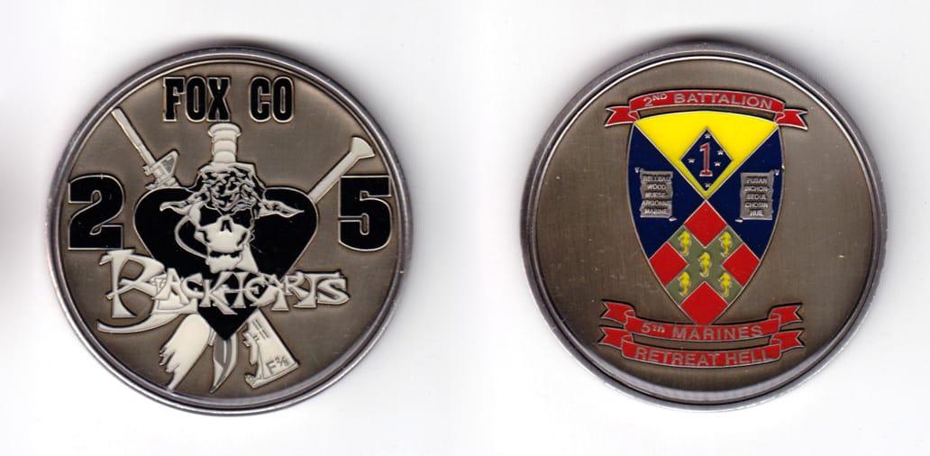 Round shaped coin, pewter in color, 2 inches in diameter.