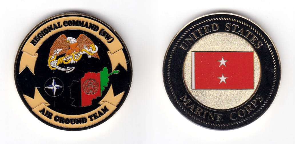 Round shaped coin, brass in color, 1 63/64 inches in diameter.