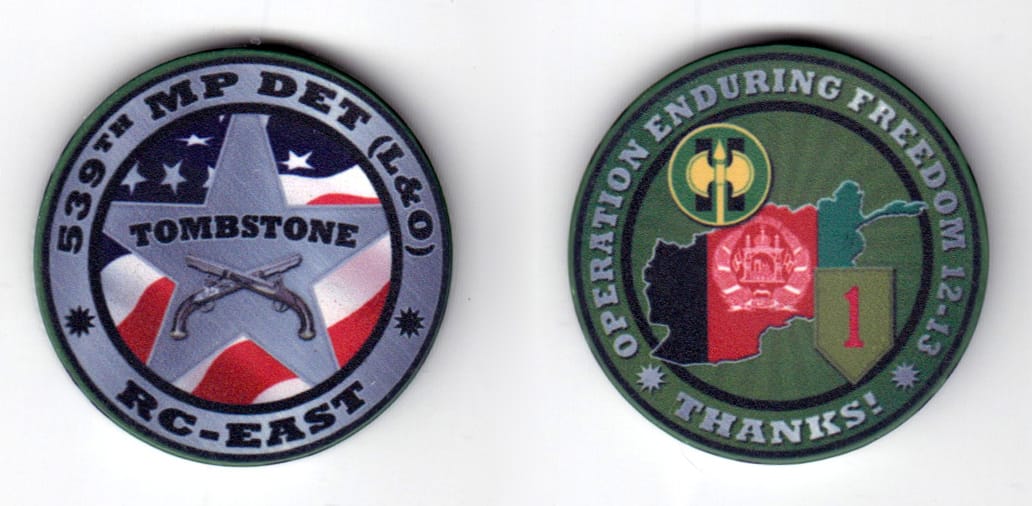 Round shaped poker chip, gray in color, 1 43/64 inches in diameter.