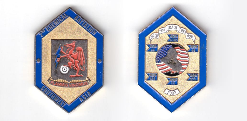 Hexegon shaped coin, brass in color, 1 31/32 inches high x 1 9/32 inches wide.