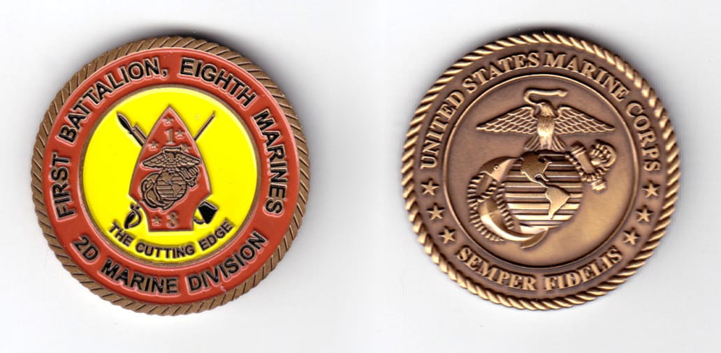 Round shaped coin, antique brass in color, 1 1/2 inches in diameter.