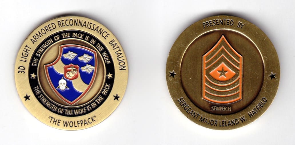 Round shaped coin, brass in color, 1 9/16 inches in diameter.