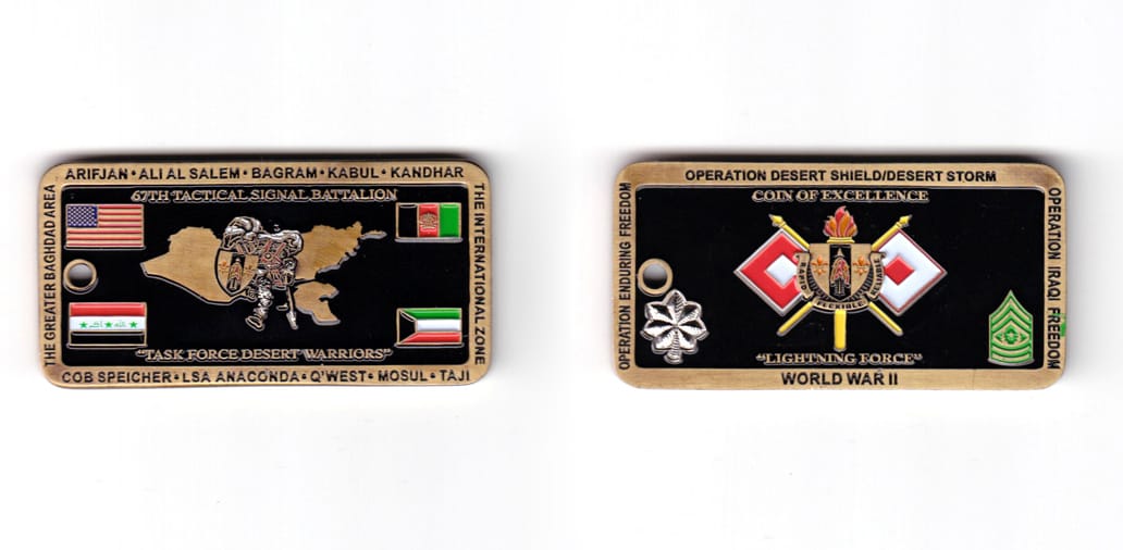 Rectangular shaped coin, antique brass in color, 1 15/64 inches high x 2 31/64 inches wide.