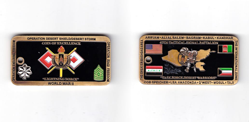 Rectangular shaped coin, antique brass in color, 1 15/64 inches high x 2 31/64 inches wide.