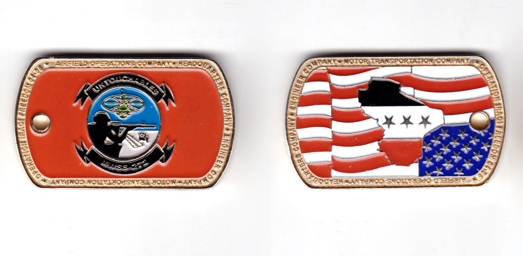 Dog tag shaped coin, brass in color, 1 13/64 inches high x 1 63/64 inches wide.