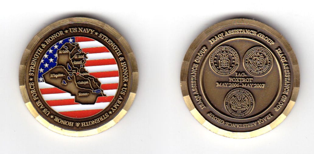 Round shaped coin, brass in color, 1 15/16 inches in diameter.