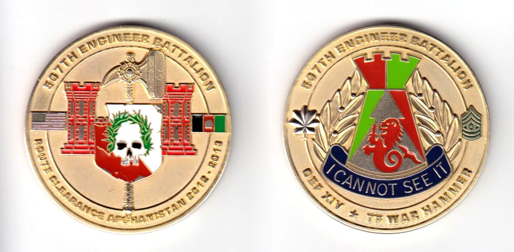 Round shaped coin brass in color, 2 inches in diameter.