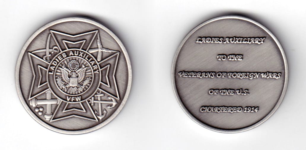 Round shaped coin, pewter in color. 1 1/2 inches in diameter.