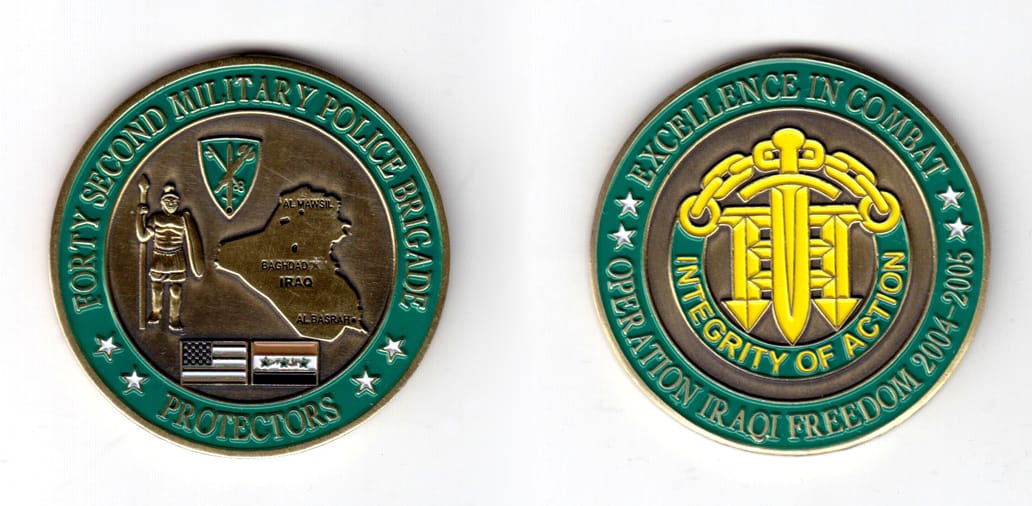 Round shaped coin, brass in color, 2 1/64 inches in diameter.