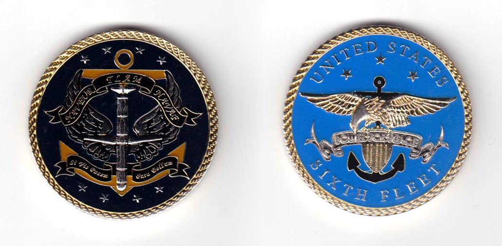 Round shaped coin, brass in color, 1 49/64 inches in diameter.