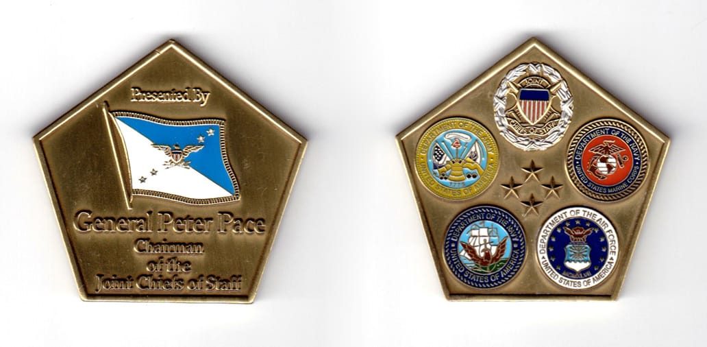 Pentagon shaped coin, antique brass in color, 1 57/64 inches high x 2 inches wide