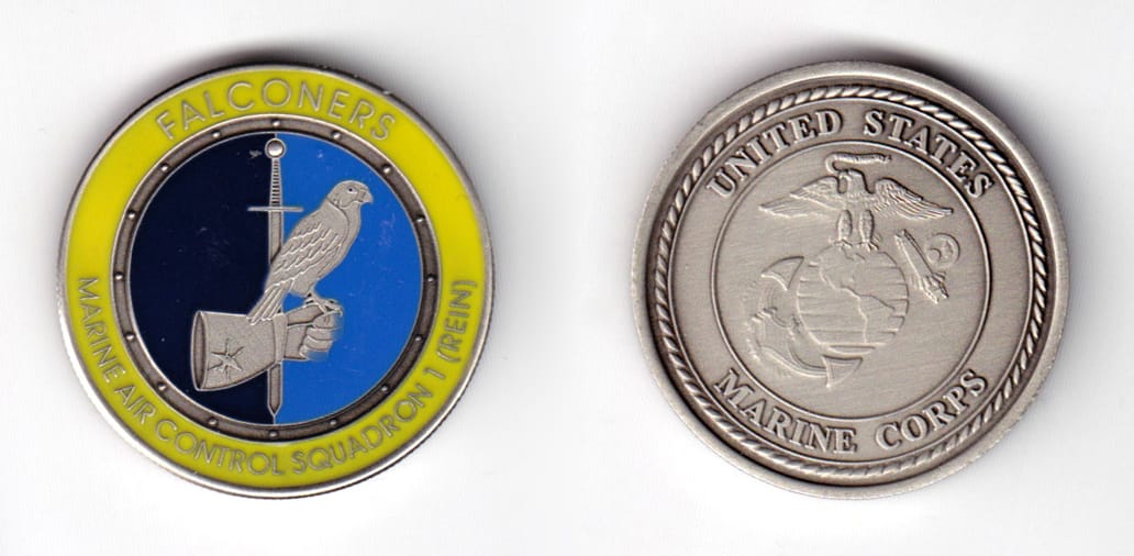 Round shaped coin pewter in color, 1 17/32 inches in diameter.