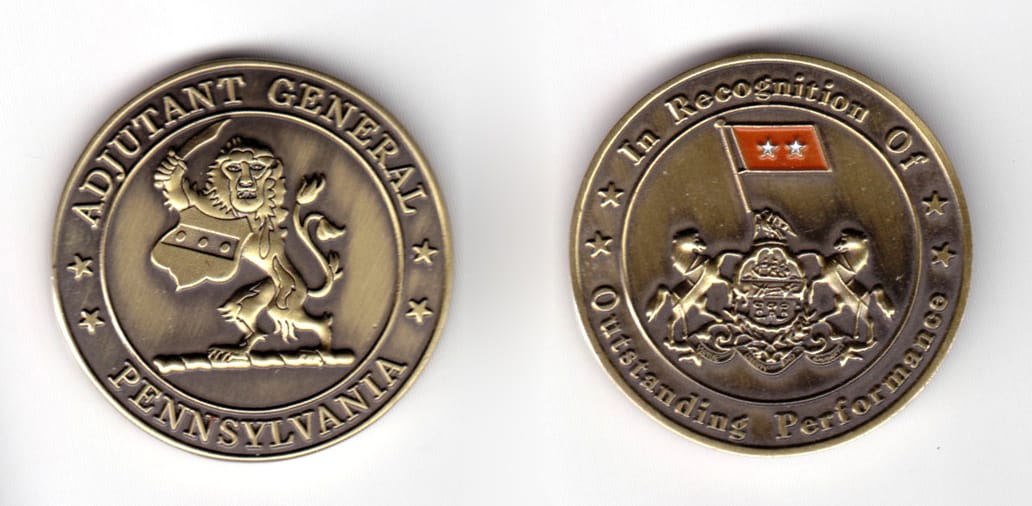 Round shaped coin, brass in color, 1 9/16 inches in diameter.