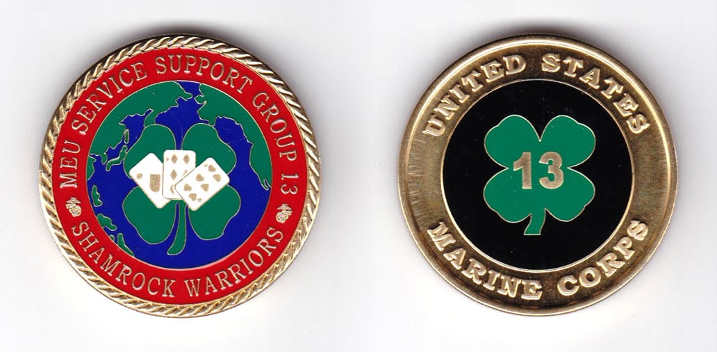 Round shaped coin, brass in color, 1 19/32 inches in diameter.