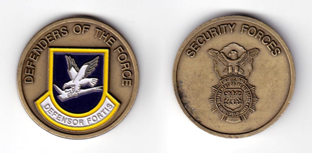 Round shaped coin, antique brass in color, 1 37/64 inches in diameter.