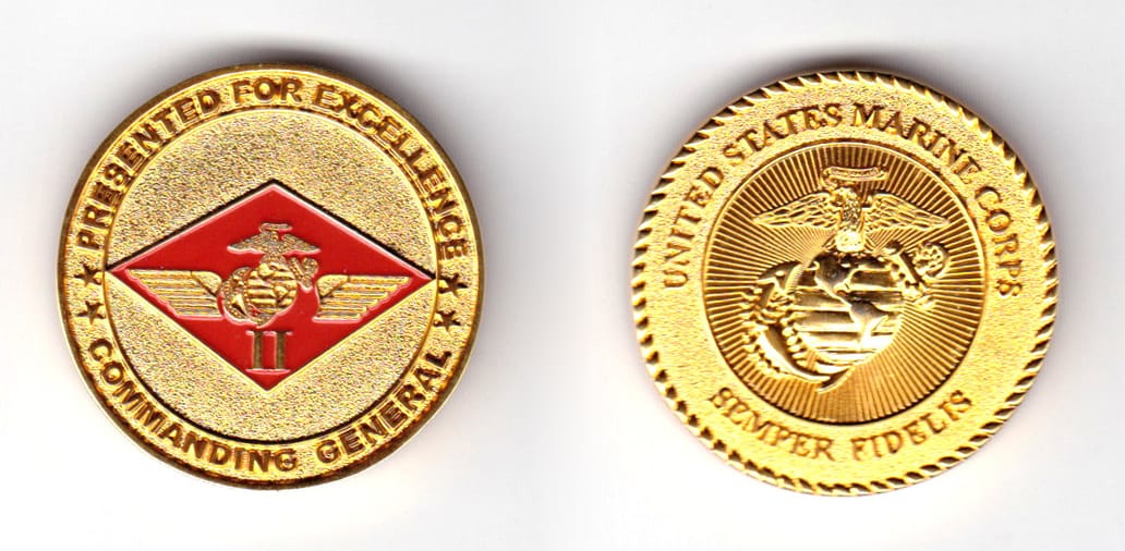 Round shaped coin, brass in color, 1 15/32 inches in diameter.