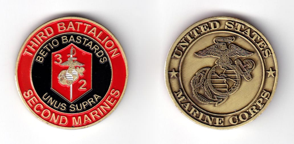 Round shaped coin, antique brass in color, 1 1/2 inches in diameter.