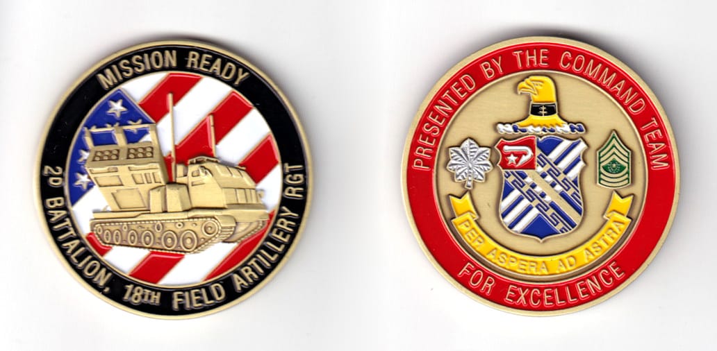 Round shaped coin, brass in color, 2 inches in diameter.