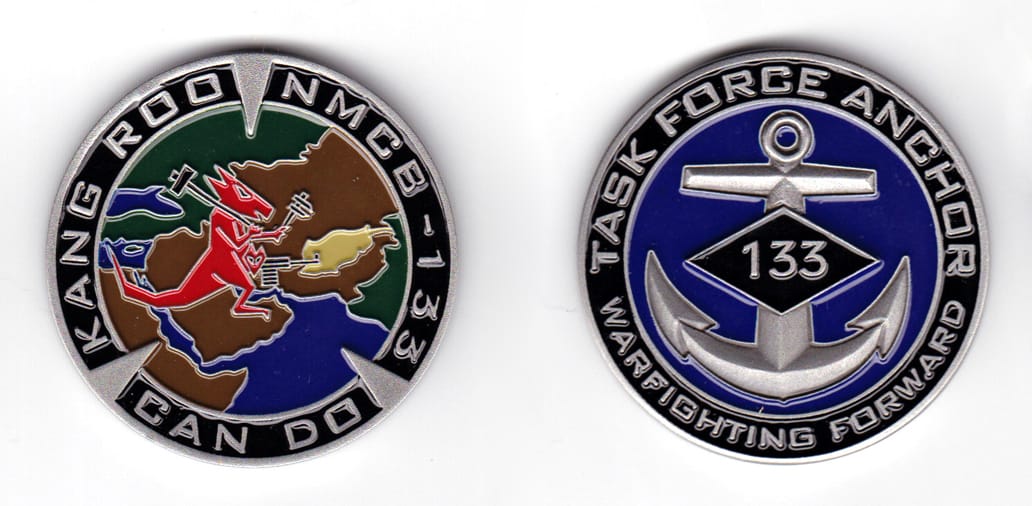 Round shaped coin, antique pewter in color, 2 inches in diameter.