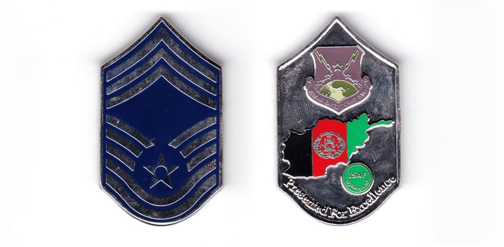 Coin is shaped in the form of a US Air Force Chief Master Sergeant's rank insignia,silver in color, 2 inches high x 1 13...