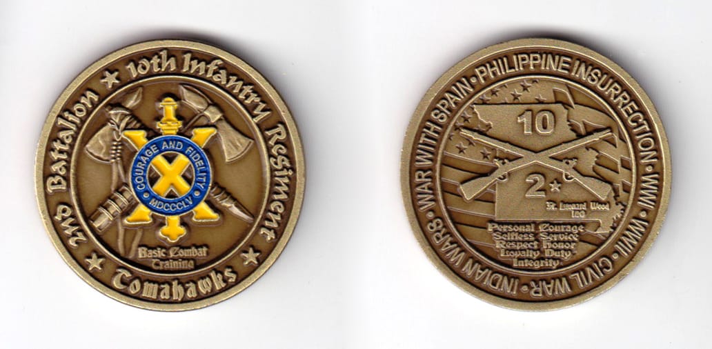 Round shaped coin, brass in color, 1 37/64 inches in diameter.