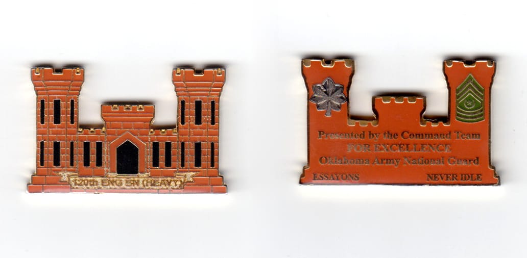 Engineer castle shaped coin, gold in color, 1 3/32 inches high x 1 45/64 inches wide.