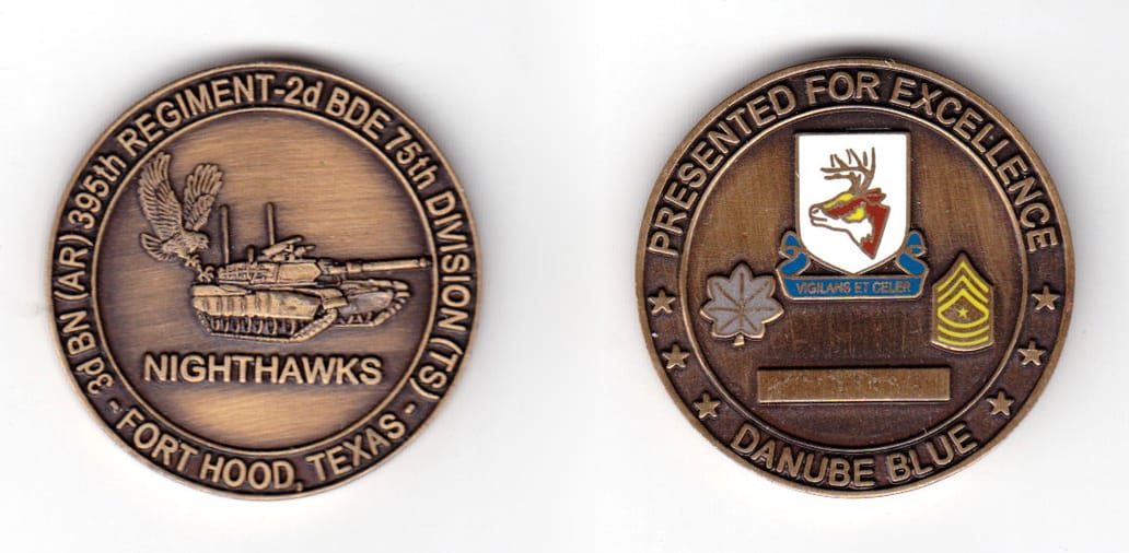 Round shaped coin, antique brass in color, 1/1/2 inches in diameter.