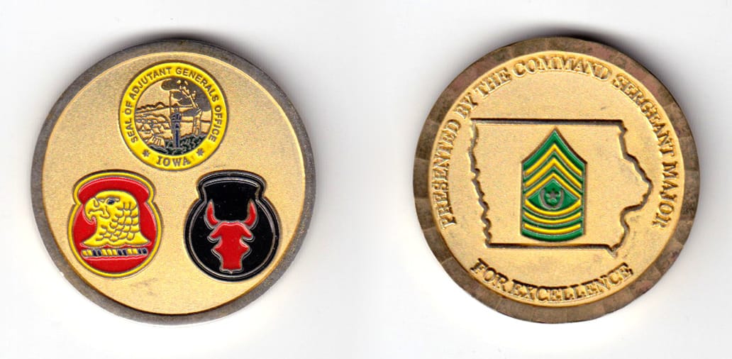 Round shaped coin, brass in color, 1 31/64 inches in diameter.