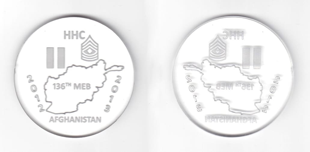 Round shaped clear plastic coin, 2 1/2 inches in diameter.