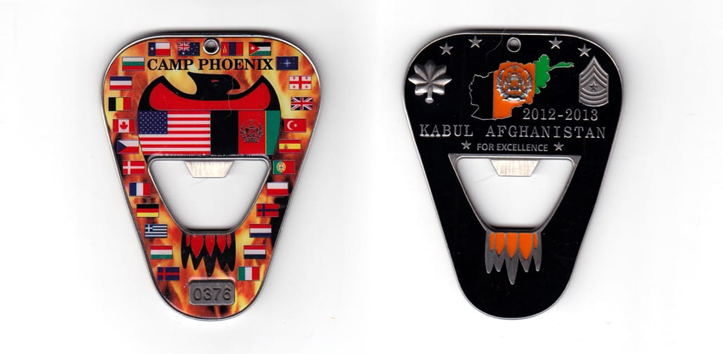 Wedge shaped bottle opener with rounded corners, pewter in color, 3 1/16th inches high x 2 11/32 inches wide.