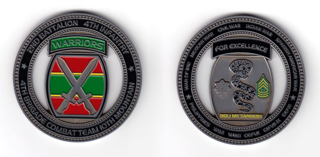 Round shaped coin, pewter in color, 2 31/64 inches in diameter.