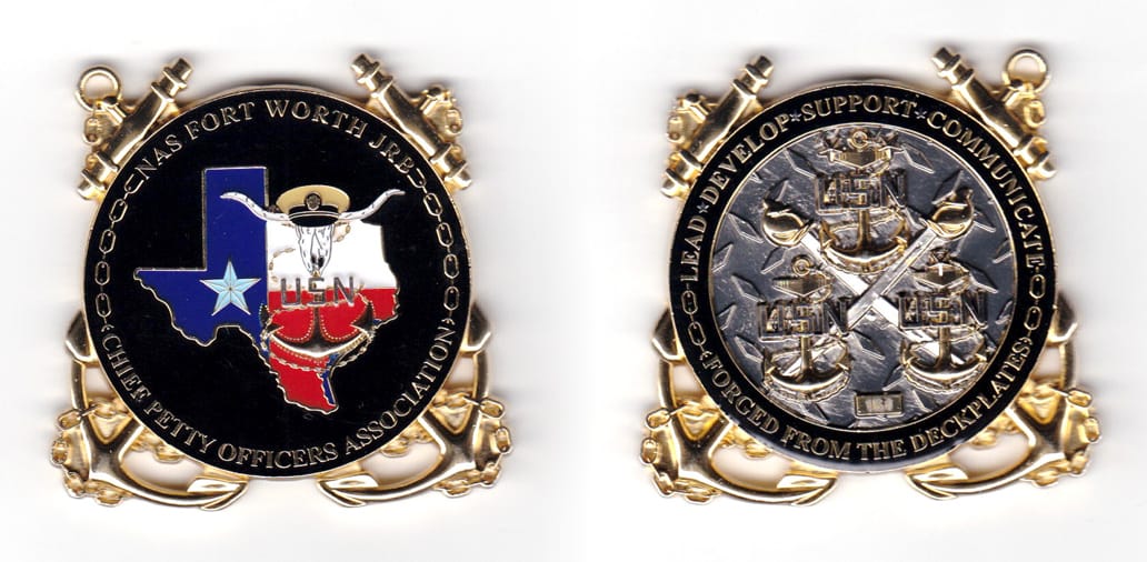 Round shaped coin with crossed anchors behind and protruding at NW, NE, SE and SW locations, gold in color, 1 1/32 inche...