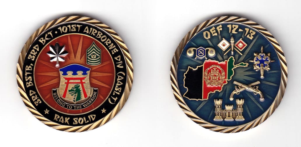 Round shaped coin, brass in color, 2 inches in diameter.