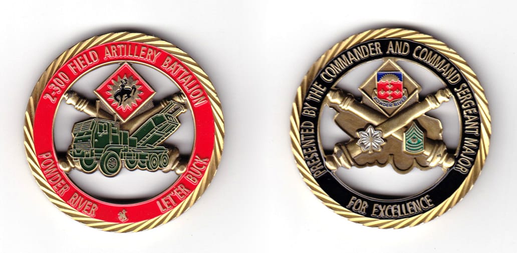 Round shaped coin, brass in color, 1 63/64 inches in diameter.