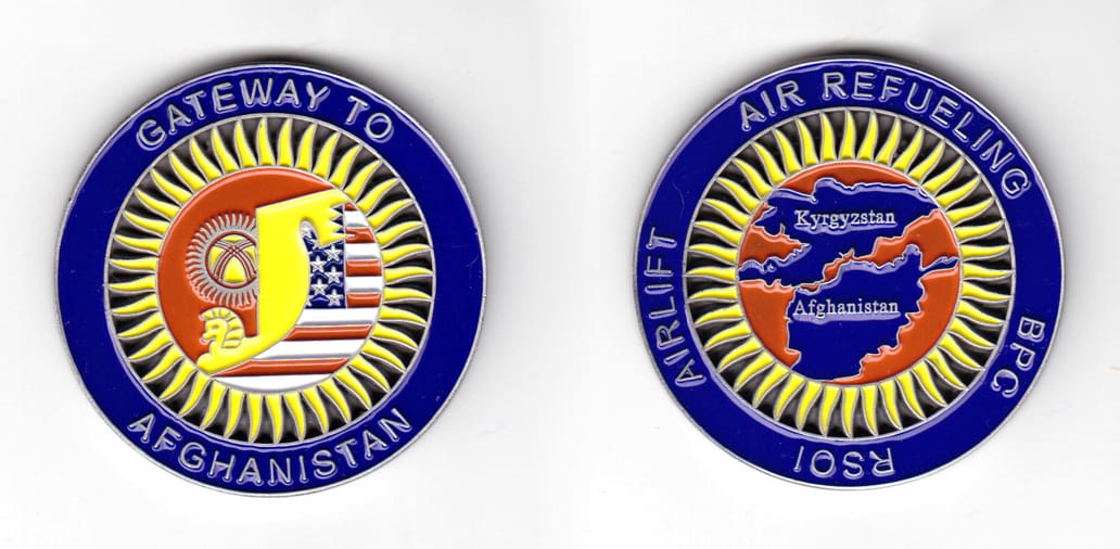 Round shaped coin, pewter in color, 1 31/32 inches in diameter.