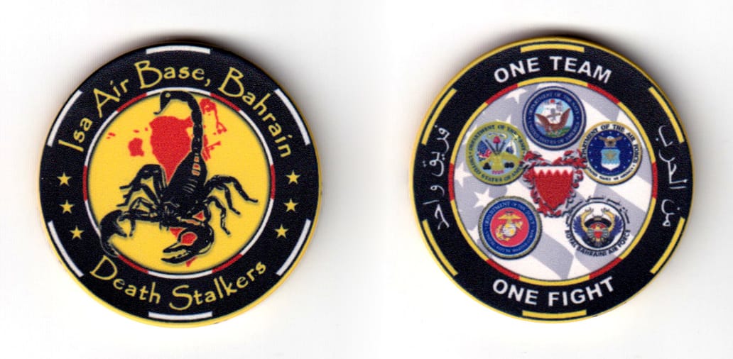 Round shaped poker chip, black & yellow in color, 1 47/64 inches in diameter.