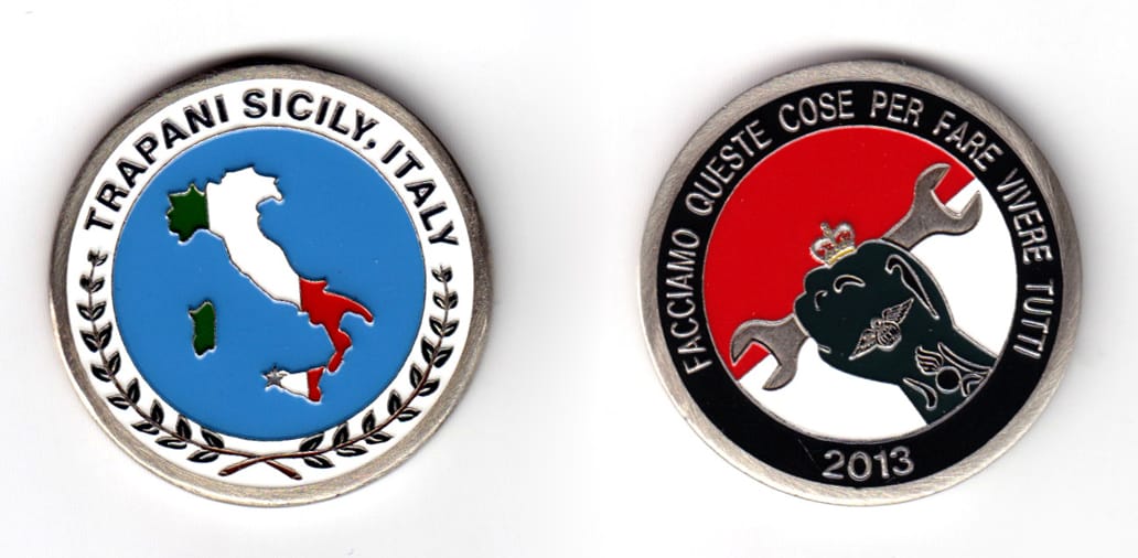 Round shaped coin, pewter in color, 1 45/64 inches in diameter.