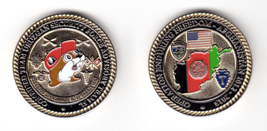 Round shaped coin, gold in color, 1 1/2 inches in diameter.