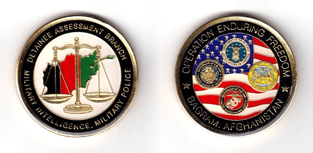 Round shaped coin, brass in color, 2 inches in diameter.