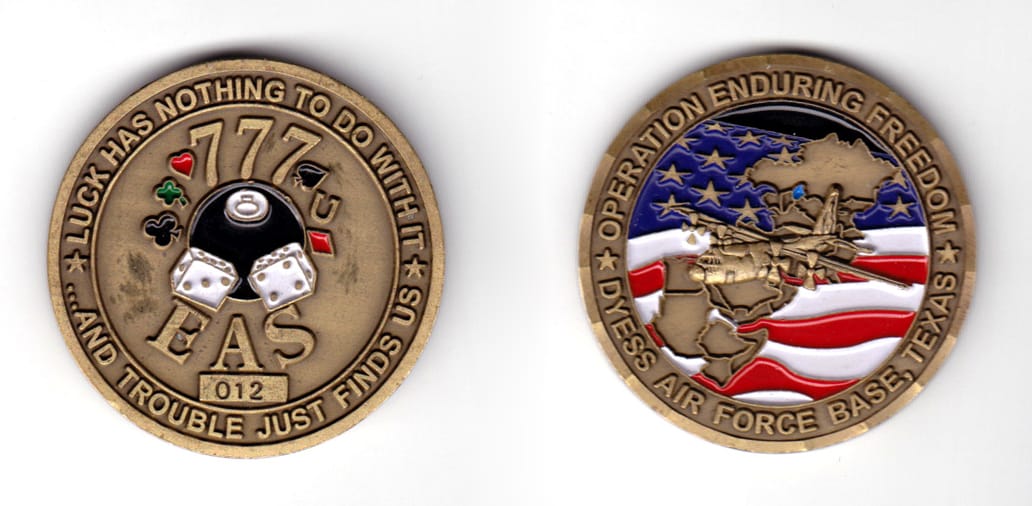 Round shaped coin, antique brass in color, 1 31/32 inches in diameter.