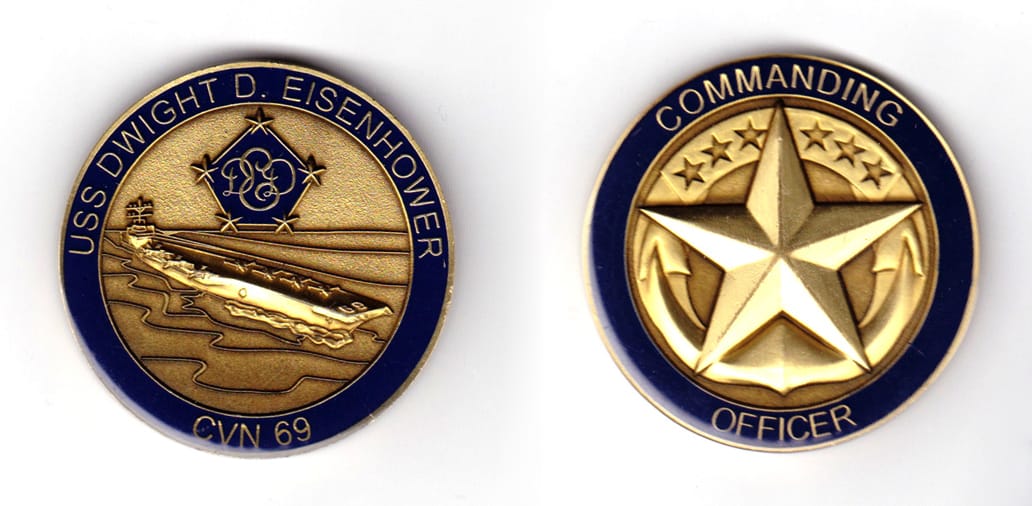 Round shaped coin, brass in color, 1 63/64 inches in diameter.