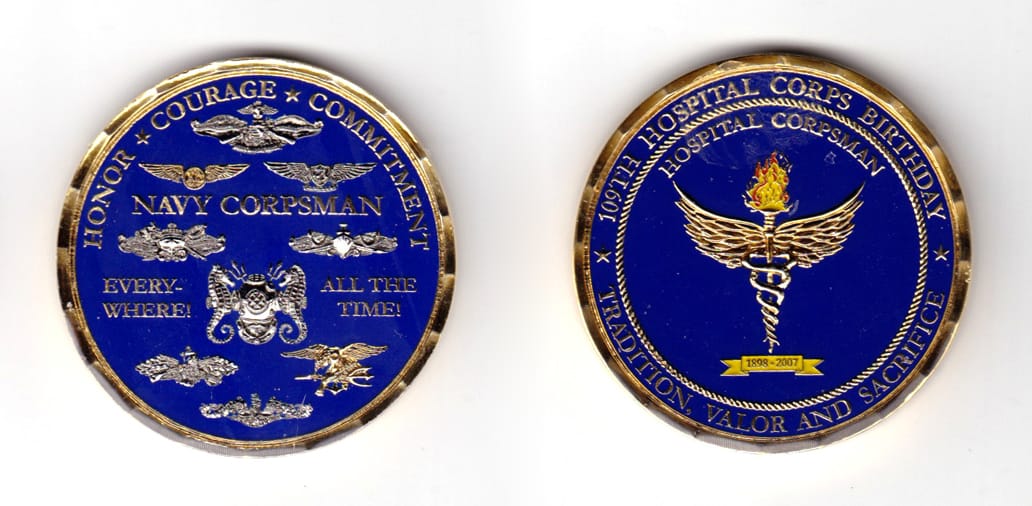 Round shaped coin, brass in color, 2 inches in diameter.