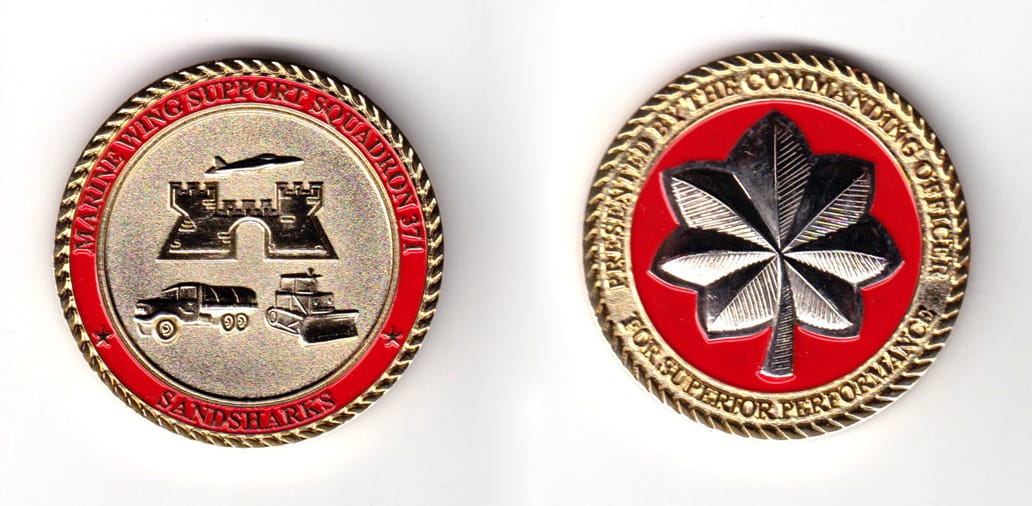 Round shaped coin, brass in color, 1 49/64 inches in diameter.