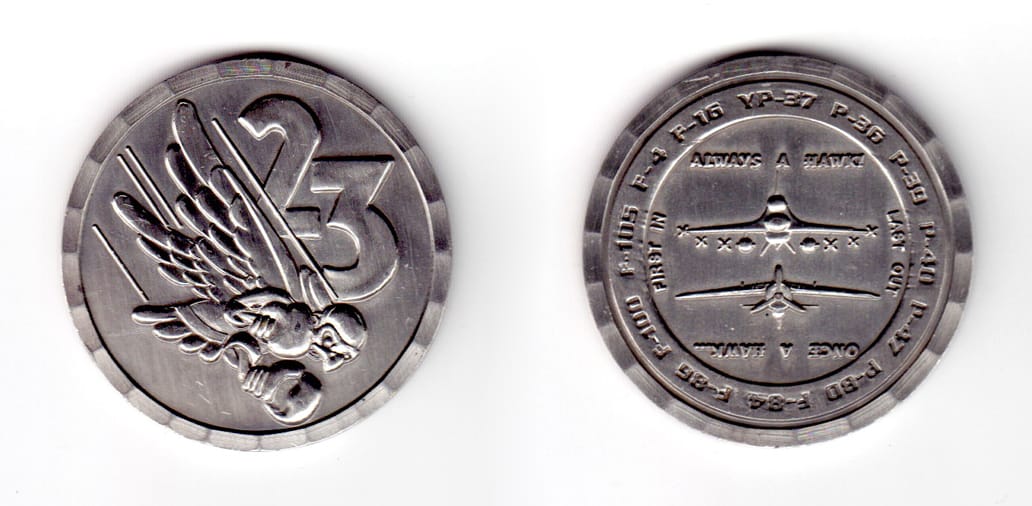 Round shaped coin, pewter in color, 1 3/4 inches in diameter.