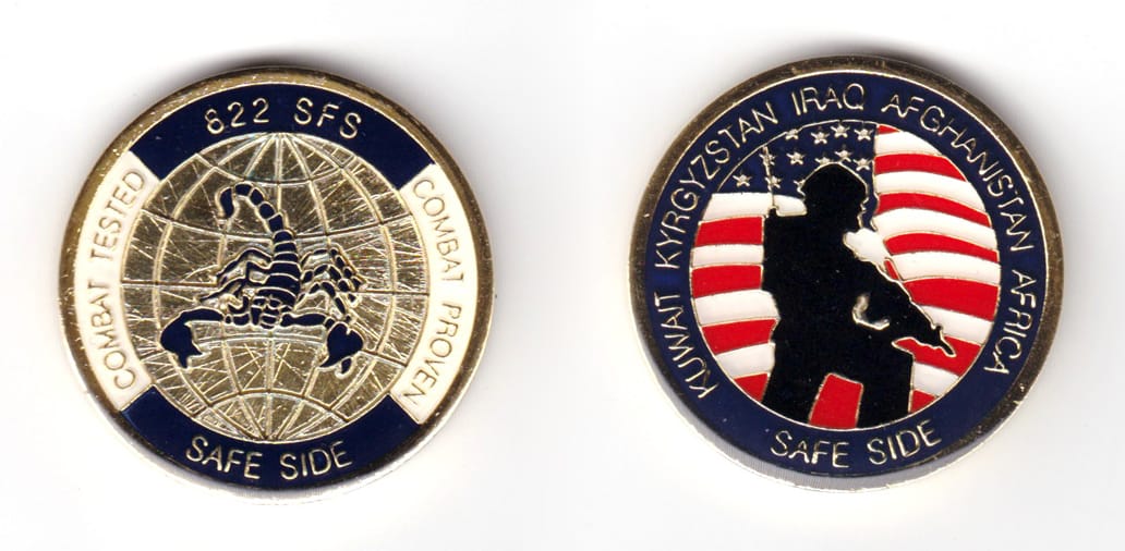 Round shaped coin, brass in color, 1 11/16 inches in diameter.