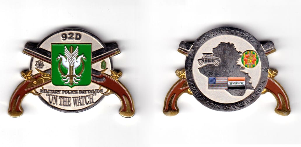 round shaped coin with a pair of crossed duelling pistols in front and protruding at NE, SE, SW & NW locations, pewter i...