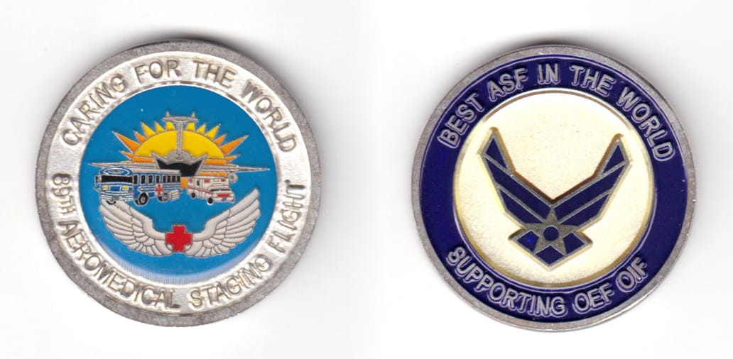 Round shaped coin, silver in color, 1 19/32 inches in diameter.