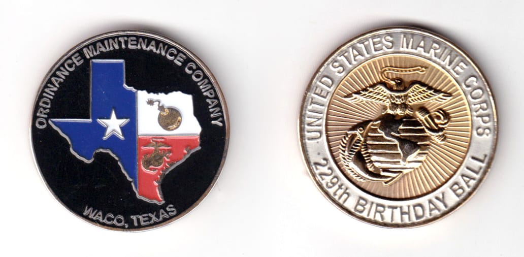 Round shaped coin, brass in color, 1 33/64 inches in diameter.