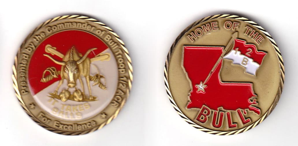 Round shaped coin, antique brass in color, 1 21/32 inches in diameter.