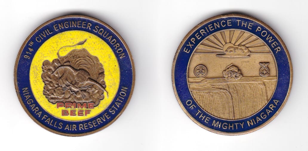 Round shaped coin, antique brass in color, 1 7/8 inches in diameter.